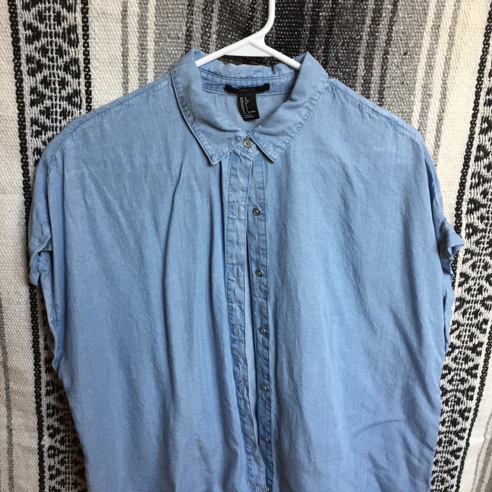 Light blue short sleeved button down top